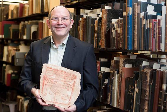 Dr. Steven Fine with ancient biblical tombstone