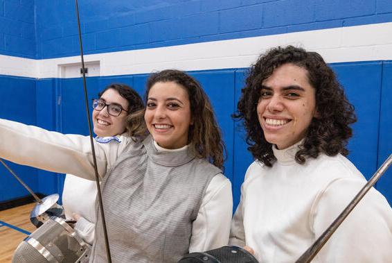 Three fencing students